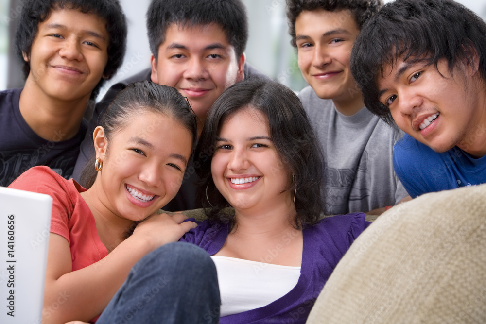 Multi ethnic students pose together Multi ethnic students pose together