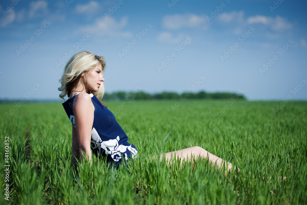 Fototapeta premium Beautiful young woman in the field
