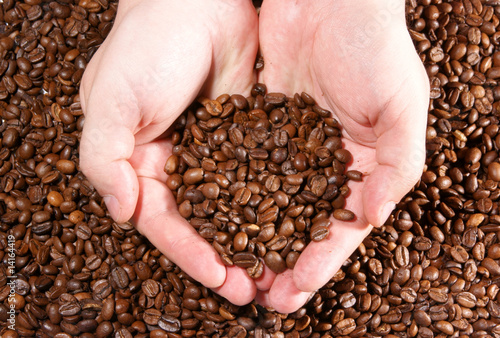   offee grains on the hands