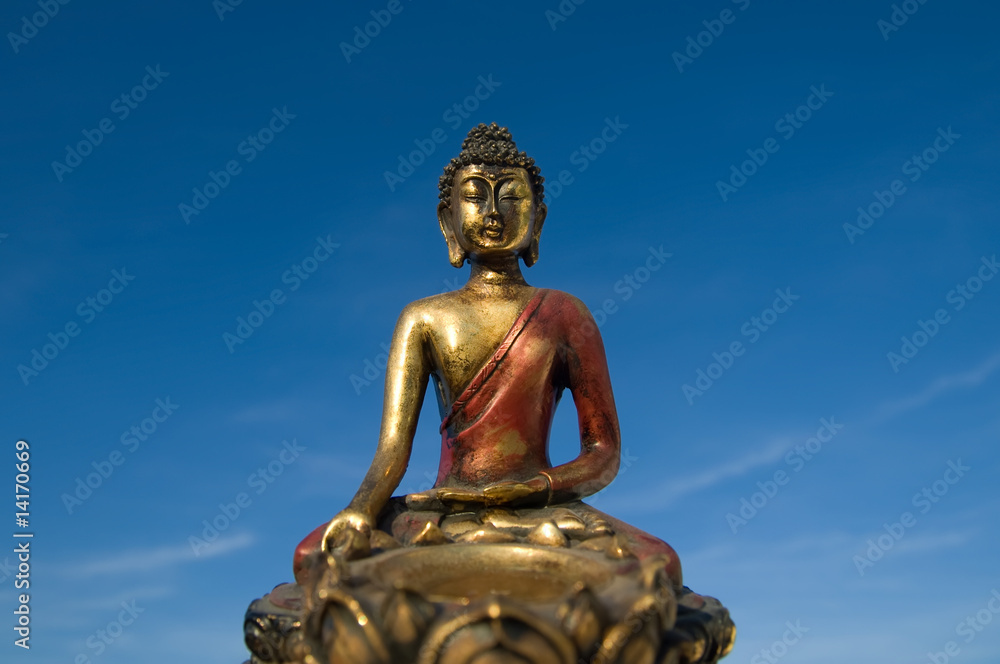 Fototapeta premium China / Tibet - Buddha in front of blue sky