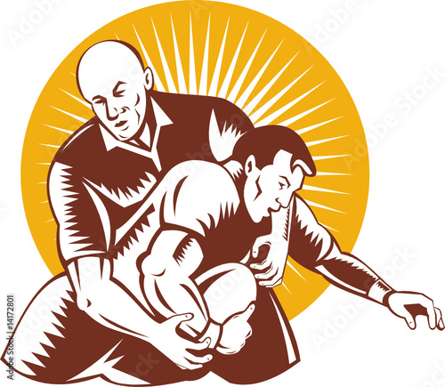 Rugby player with ball being tackled