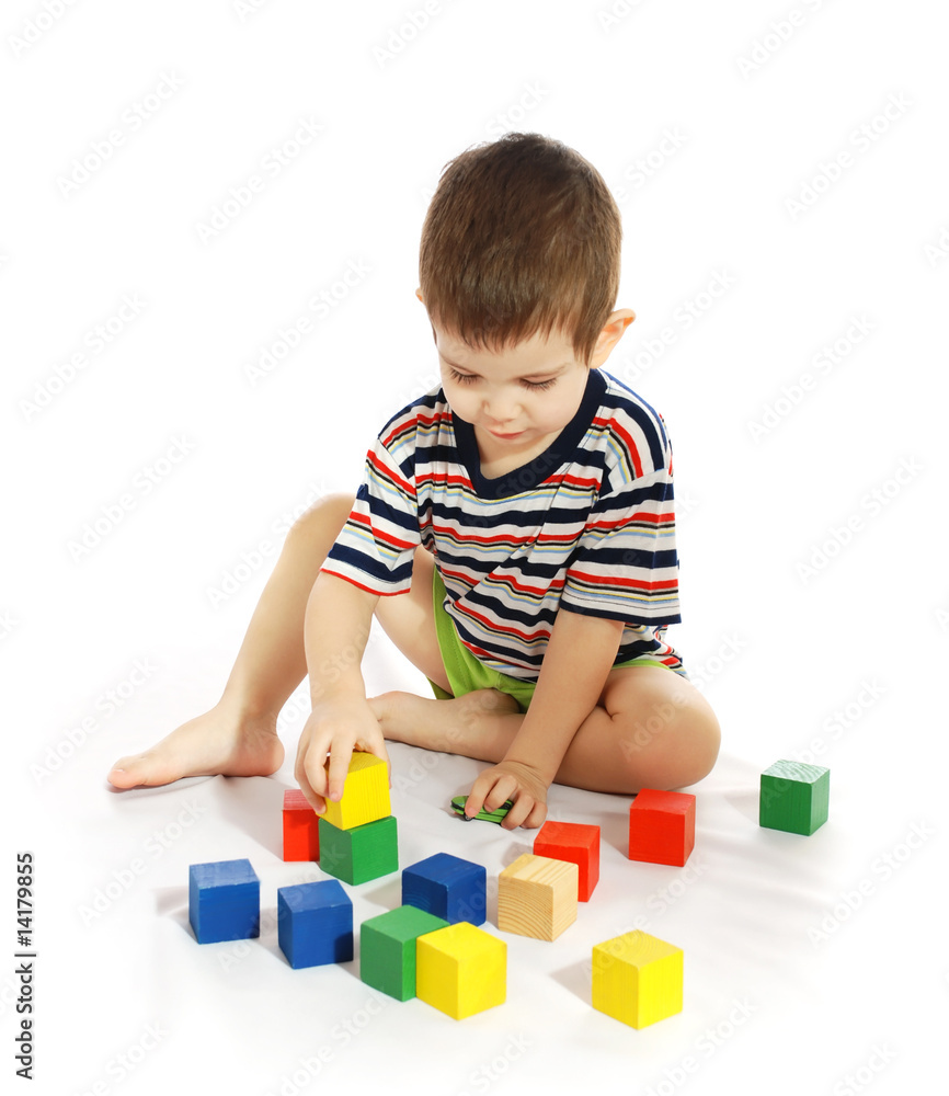 The little boy plays with cubes The little boy plays with cubes