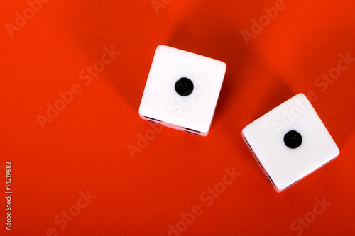 dices on red background - one one