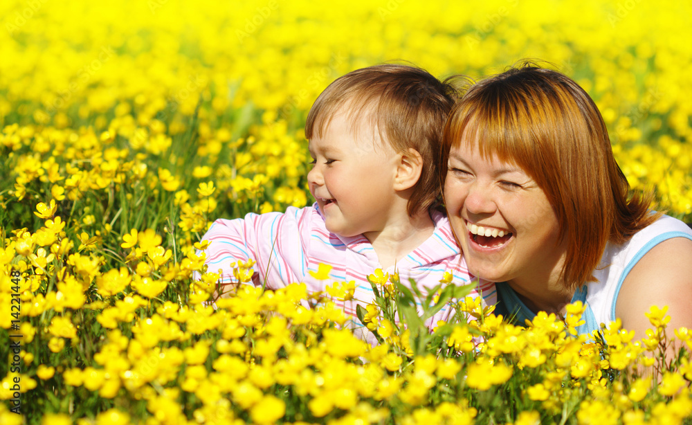 Mother and child play on meadow Mother and child play on meadow