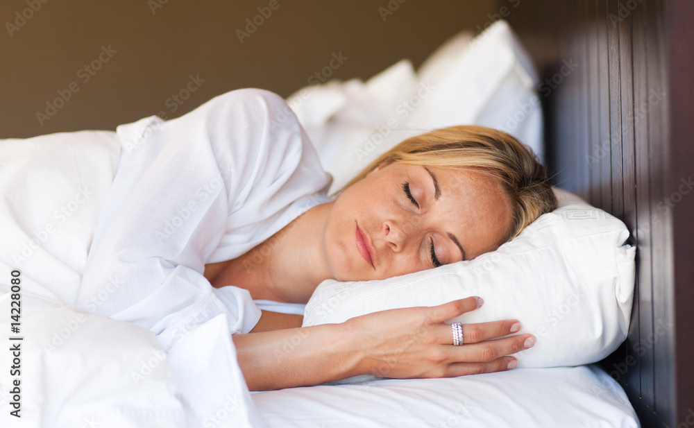 Young woman relaxing in bed Young woman relaxing in bed