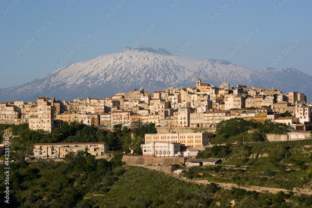 view of village and belltower on background Etna