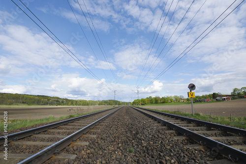 railraod tracks against horizon photo