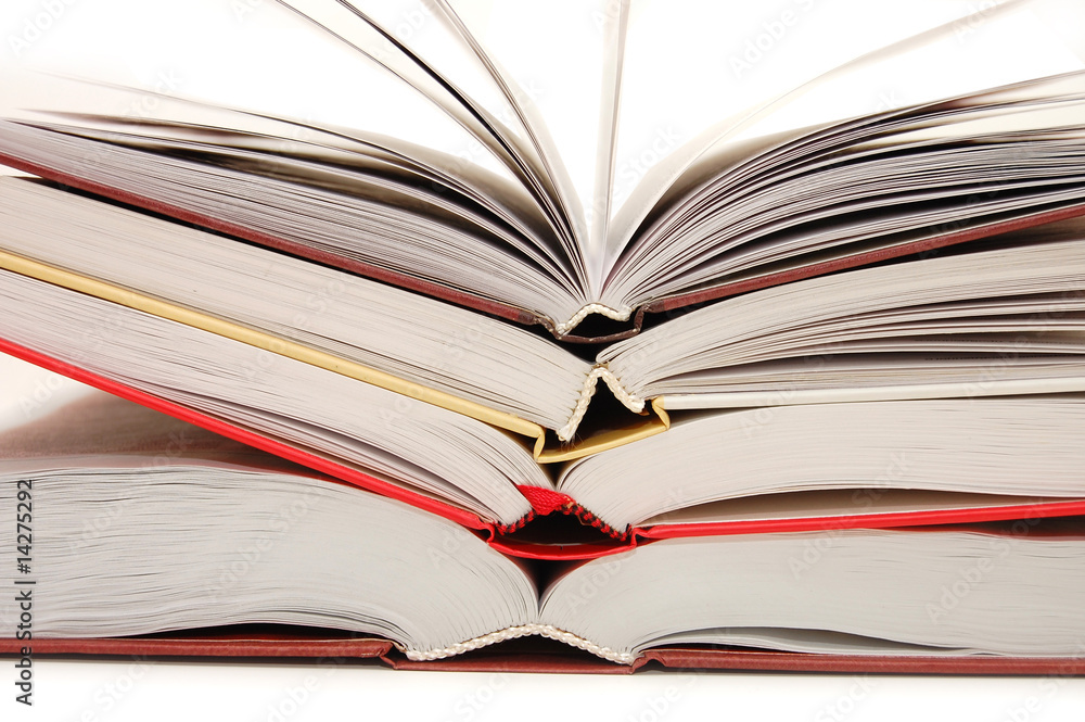 The front view of a stack of open books The front view of a stack of open books