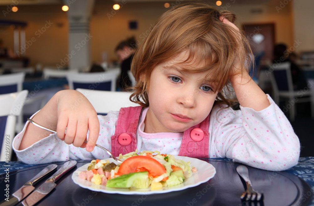 Sad girl behind table in cafe Sad girl behind table in cafe