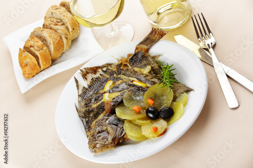 Baked turbot with vegetables and white wine