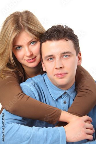 Girl embraces man for neck behind