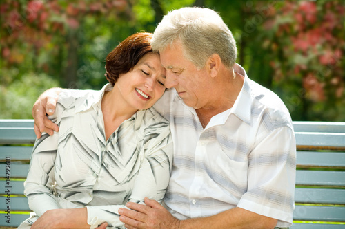 Mature attractive happy couple together in park