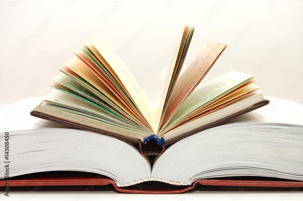 The front view of a stack of open books The front view of a stack of open books