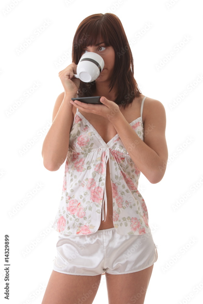Fototapeta premium Beautiful young woman is drinking her morning coffee