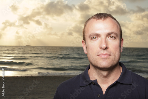 Headshot of a man on the beach