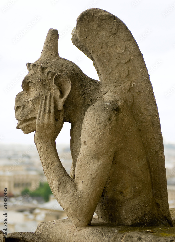 Chimera of Notre Dame de Paris. Close up of gargoyle.