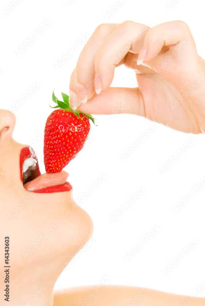 Obraz premium Young girl eat strawberry