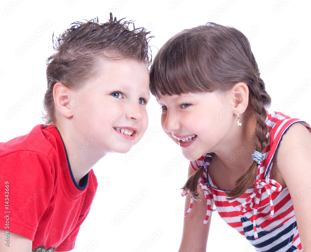 Cute blue-eyed boy and girl are playing