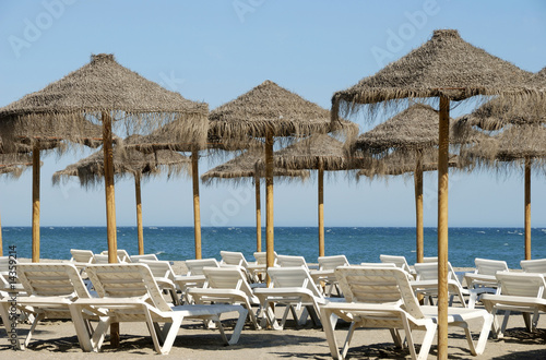 Beach chairs and sun shades