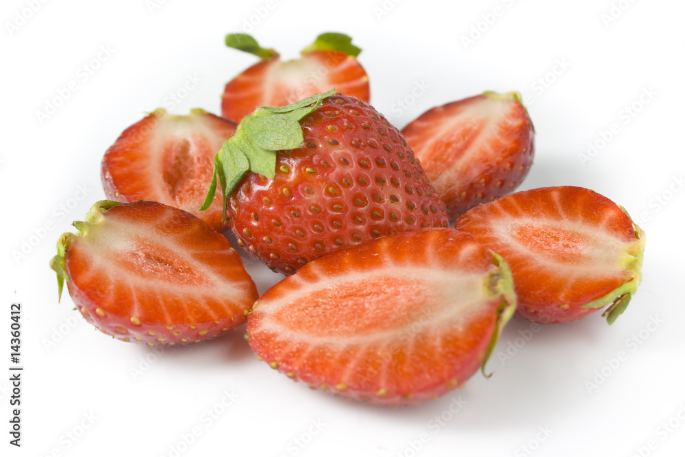 whole strawberry and the berries of a strawberry cut on halves. whole strawberry and the berries of a strawberry cut on halves.