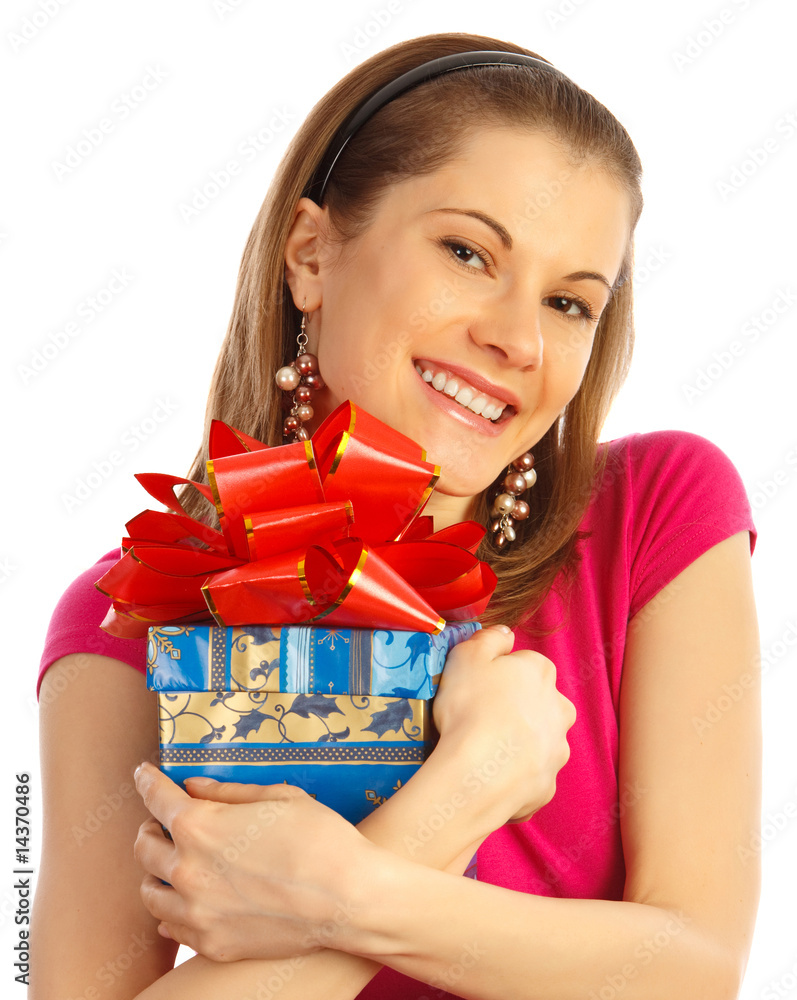 Pretty girl holding a gift. Isolated on white