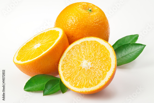 Oranges with leaves on white