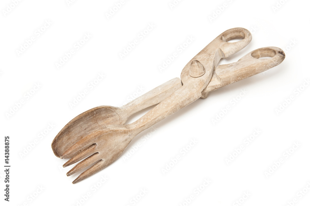Wooden tongs isolated on a white studio background. Wooden tongs isolated on a white studio background.