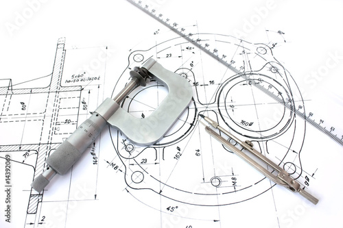 Micrometer compass and ruler on technical drawings
