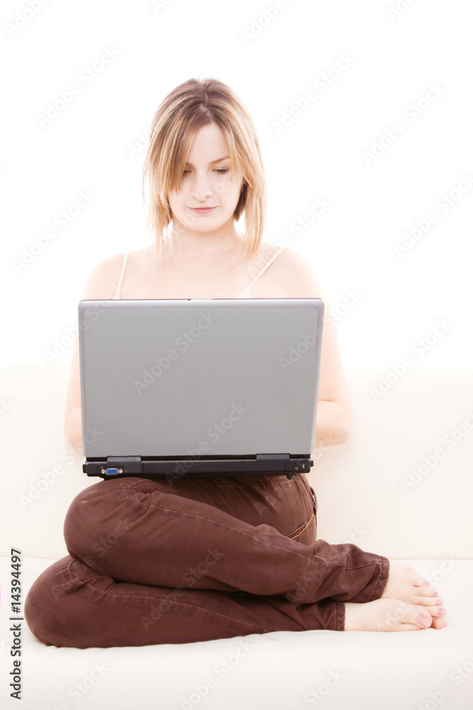 Woman with laptop on the couch Woman with laptop on the couch