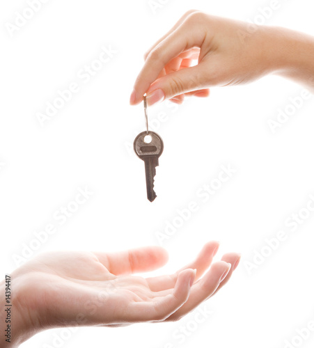 Close-up of handing over a key