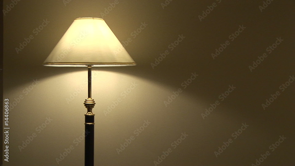 Floor lamp switched on in a dark room Floor lamp switched on in a dark room