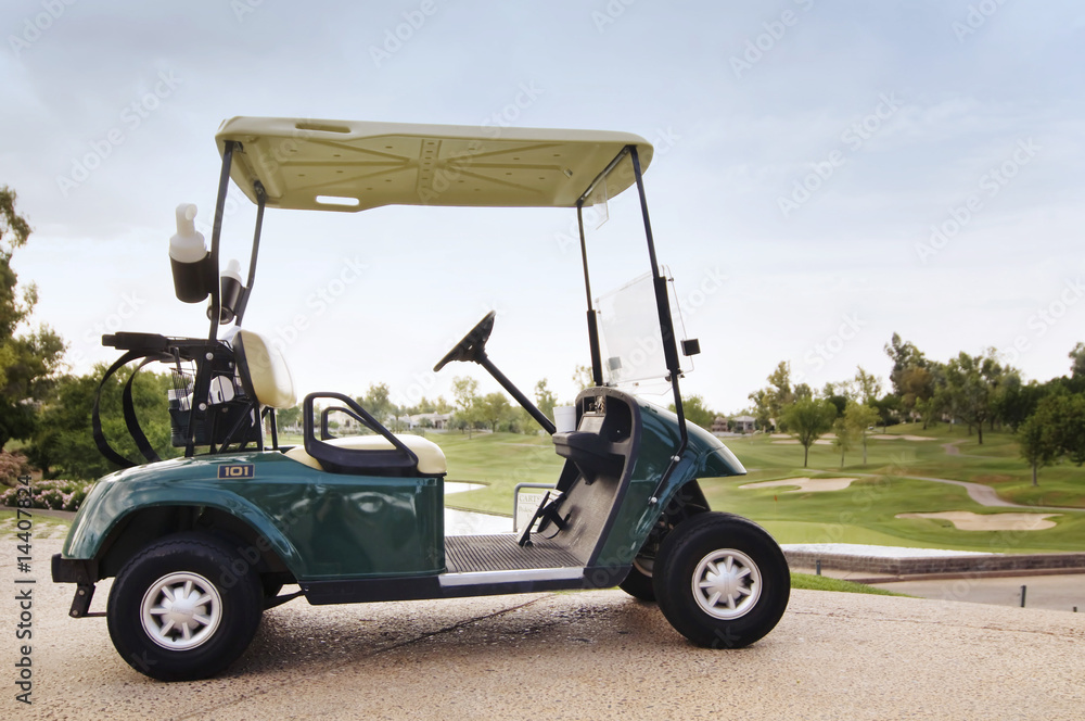 Golf cart ready for golfers on first hole