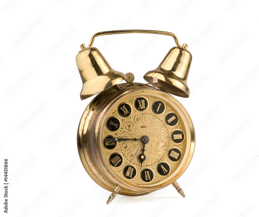 Old antique alarm clock isolated on white