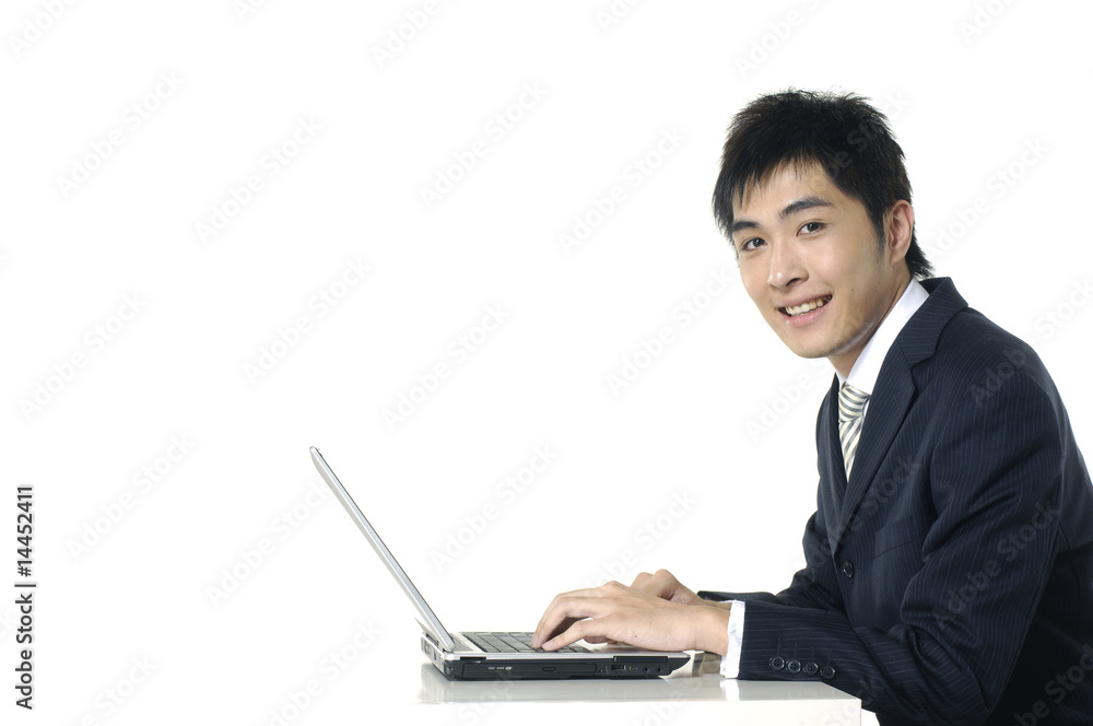 businessman working with his laptop at his desk businessman working with his laptop at his desk