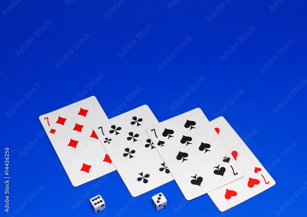 The dice and playing cards on blue background The dice and playing cards on blue background