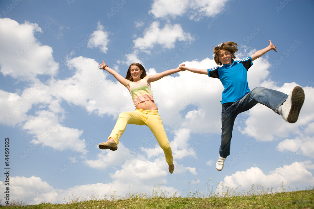 Girl and boy jumping. Soft focus. Focus on eyes Girl and boy jumping. Soft focus. Focus on eyes