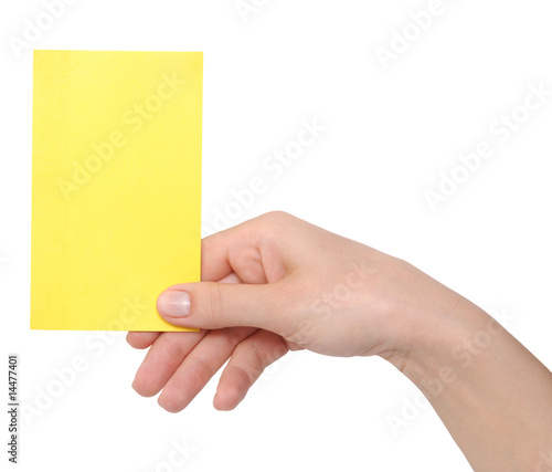 yellow card in a hand