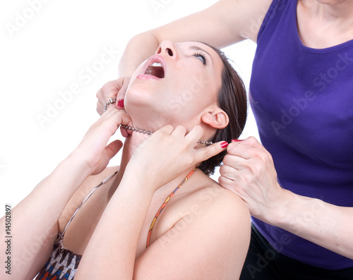 Obraz na plátně Dangerous woman from behind try to strangle a another woman
