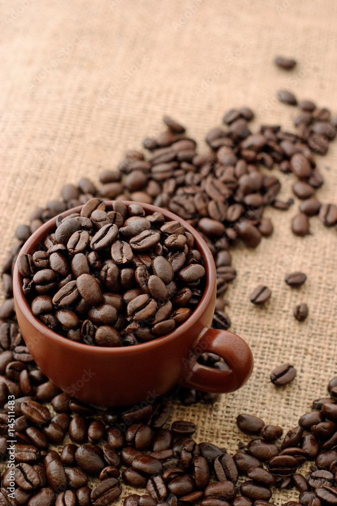 cup of coffe beans on burlap cup of coffe beans on burlap