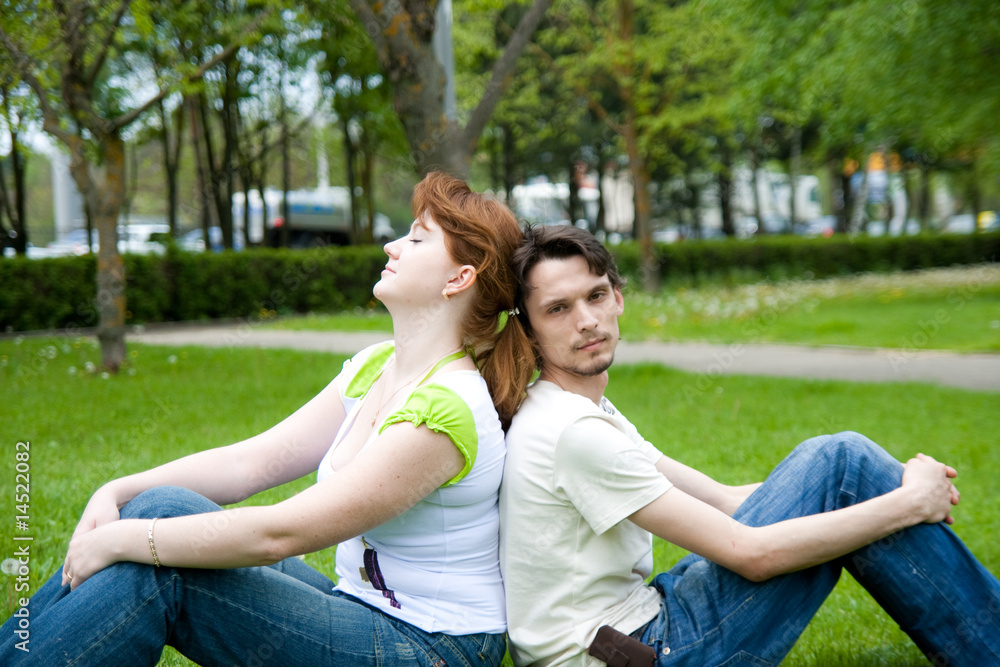 man and woman on the green grass man and woman on the green grass