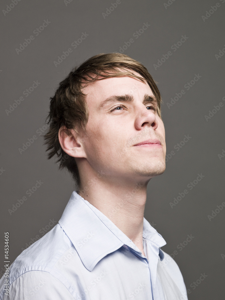 Portrait of a serious man looking upwards Portrait of a serious man looking upwards