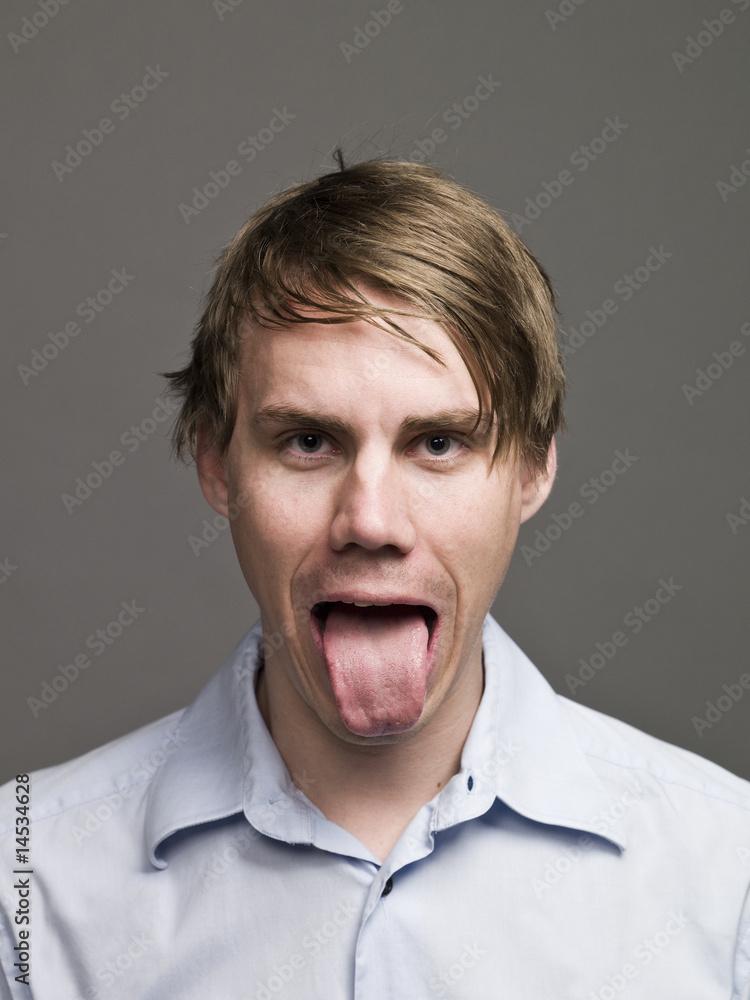 Portrait of a man making a funny face with his tongue