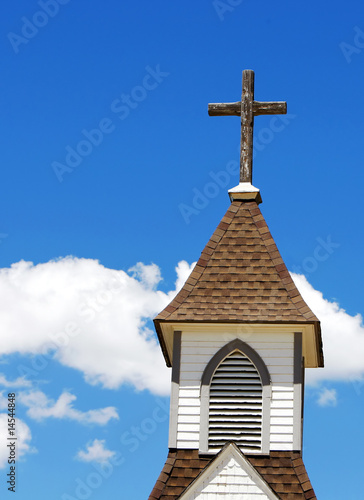 Rugged Cross on a Country Church's White Steeple