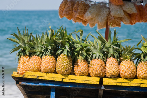 Pineapples for sale on tropical beach