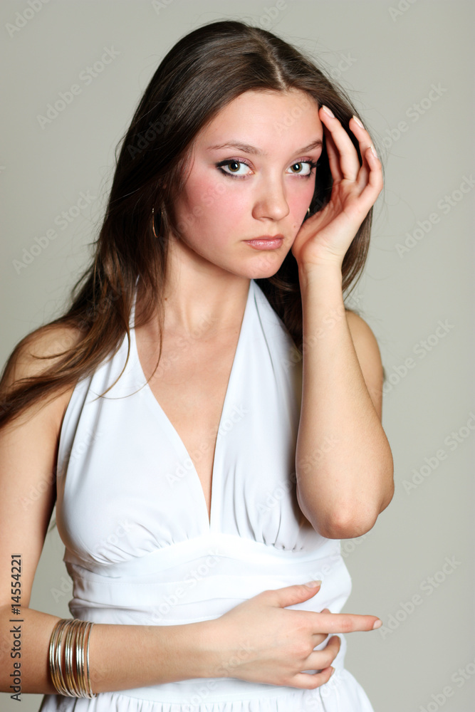 Portrait of the beautiful girl in a fashionable dress Portrait of the beautiful girl in a fashionable dress