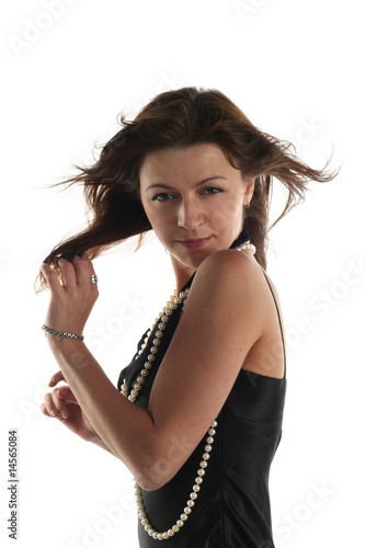 Girl in black dress isolated on white background