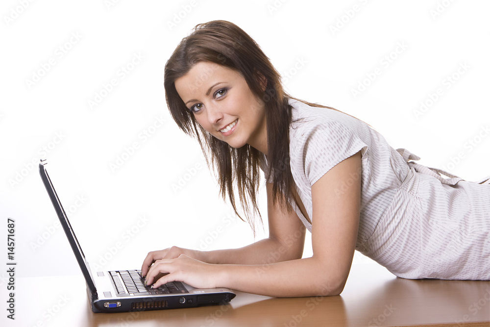 Smiling woman using her laptop Smiling woman using her laptop