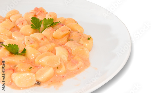 Potato dumplings with salmon ragout - Italian food