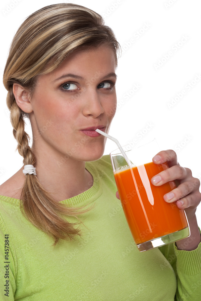 Healthy lifestyle series - Blond woman drinking carrot juice Healthy lifestyle series - Blond woman drinking carrot juice