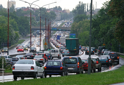 Rush hour traffic lined up car by car on the downtown streets